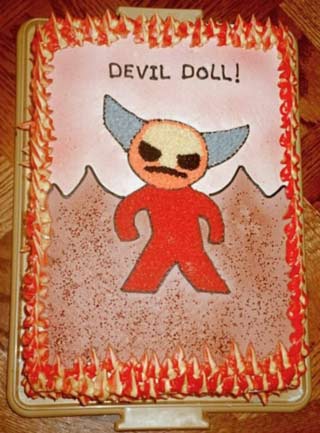I convinced my Mom to make me a Devil Doll cake and here is the picture